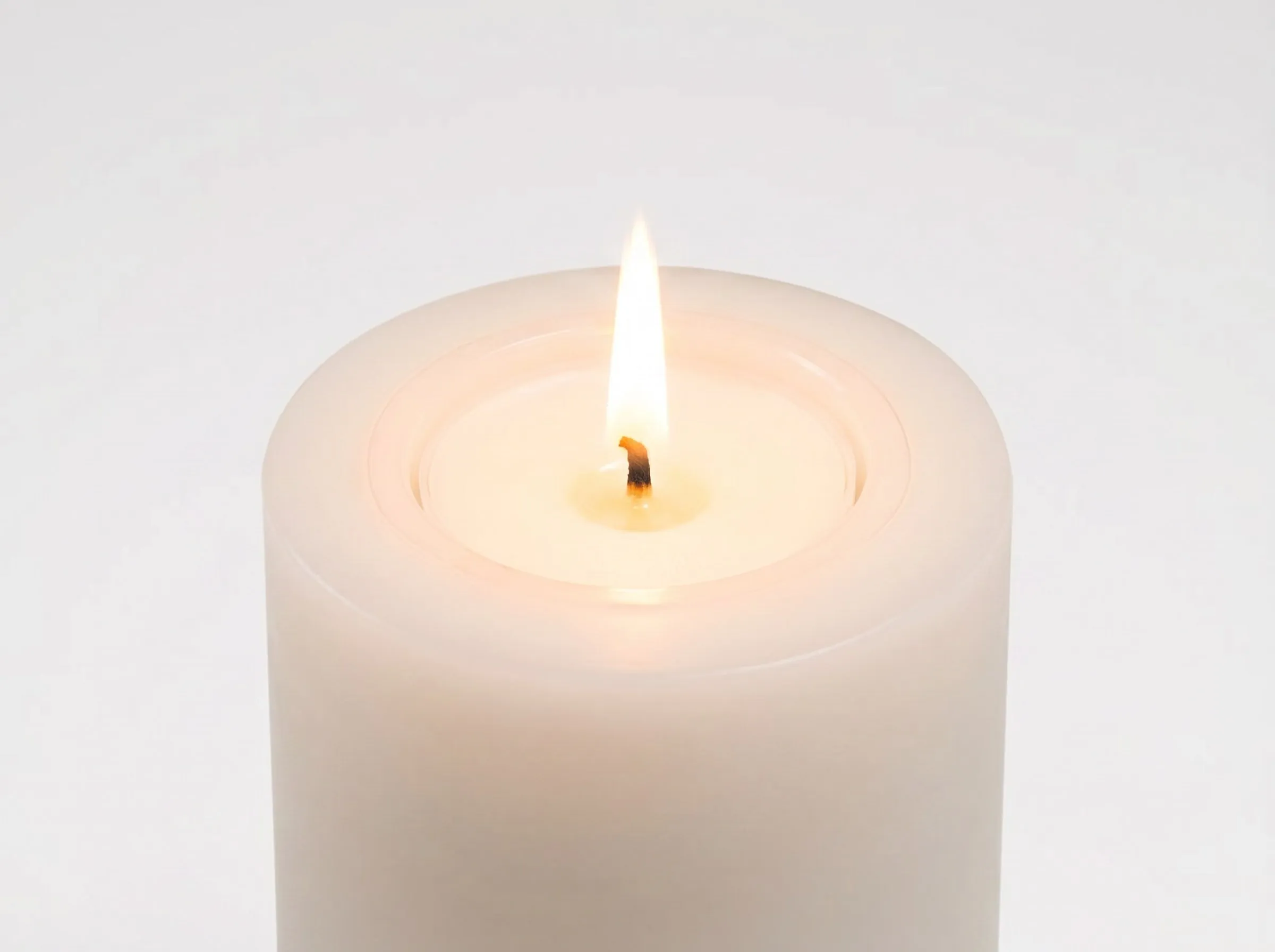 Lit pod with a tall flame, close up